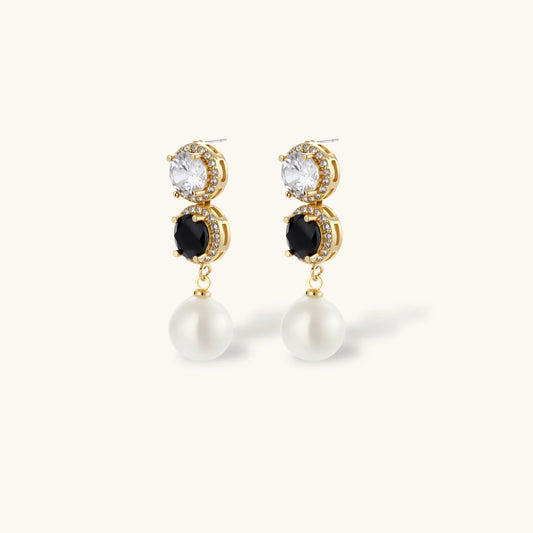 Gold-plated jewelry set with alternating black and clear cubic zirconia stones, featuring necklace, earrings and bracelet