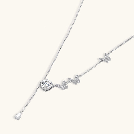 Sterling silver Y-shaped necklace with butterfly charms and brilliant moissanite stone with teardrop pendant