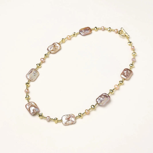 Iridescent baroque pearls alternating with small freshwater pearls on 14K gold-plated chain