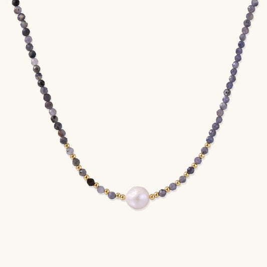 Dainty necklace with faceted purple iolite beads, gold vermeil accents, and central pink-white freshwater pearl.