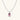 Translucent pink skull pendant with silver bow detail on delicate white gold plated chain against cream background