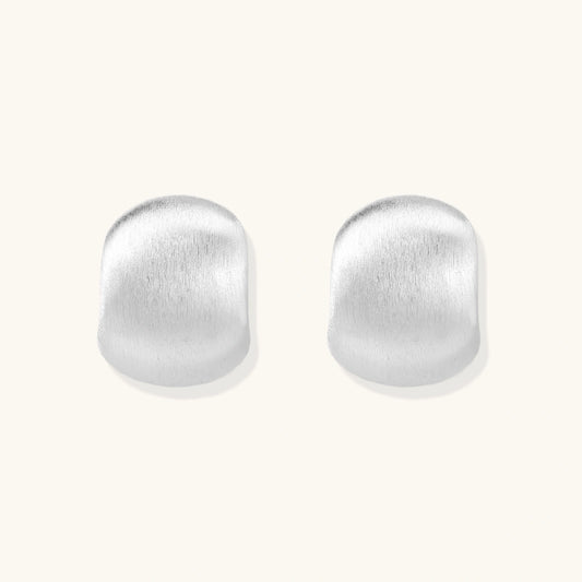 Brushed sterling silver cushion-shaped stud earrings with matte finish on white background