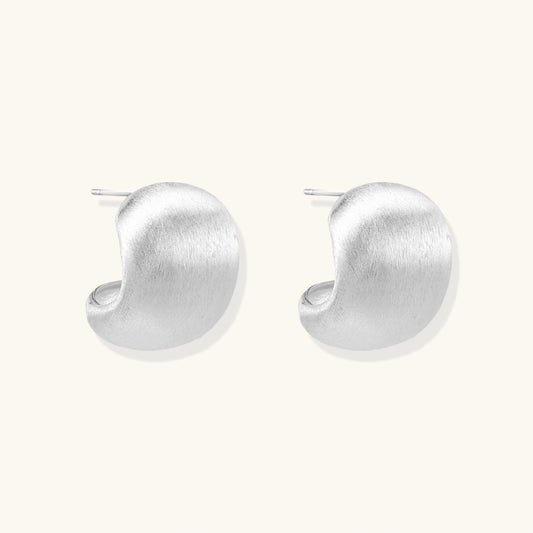 Brushed sterling silver cushion-shaped stud earrings with matte finish on white background