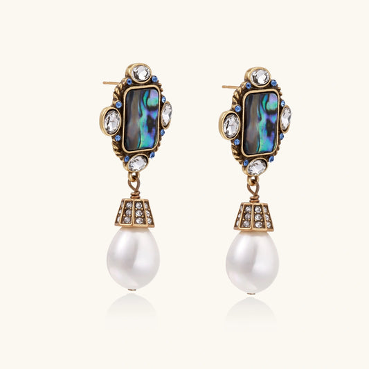 Ornate gold-plated drop earrings with rectangular abalone shell centers, crystal accents, and baroque pearl drops