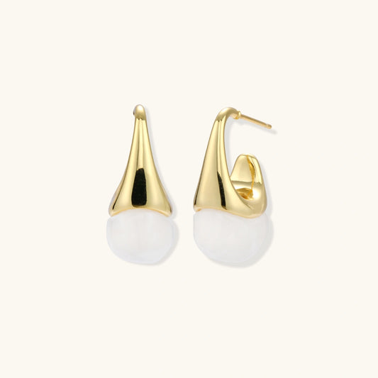 Pair of small gold-plated hoop earrings with triangular cone fronts and curved backs on white background.