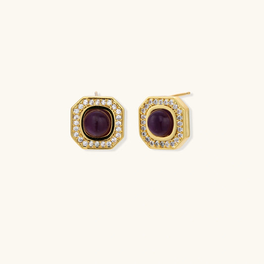 Gold-plated octagonal stud earrings with burgundy liuli centers and cubic zirconia halos on white background