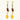 Gold-plated dangle earrings with brown gemstones, star charms, and yellow amber drops on cream background.