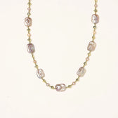 Iridescent baroque pearls alternating with small freshwater pearls on 14K gold-plated chain
