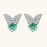 Sterling silver butterfly stud earrings with crystal wings and mint green center stones on cream background.