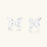 Pair of translucent butterfly-shaped stud earrings with frosted finish and dimensional wing details on white background