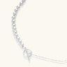 Long sterling silver beaded necklace with graduated sphere design, toggle clasp, and delicate chain extension on white background